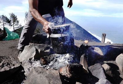 Midsection of man preparing food