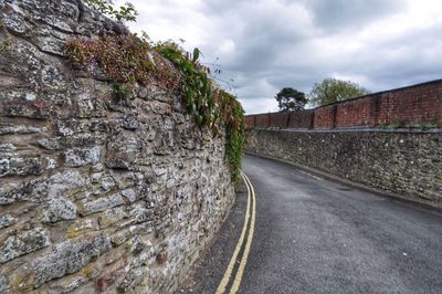 View of road against cloudy sky