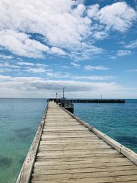 Pier over sea against sky