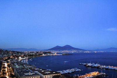 Scenic view of cityscape against blue sky