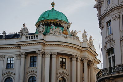 Low angle view of hofburg against sky in city