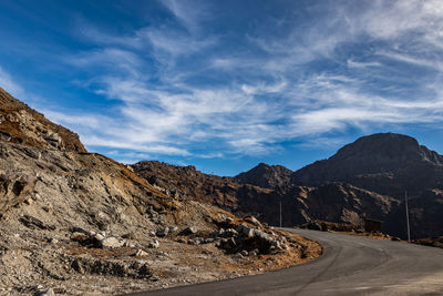 Himalayan breathtaking landscape with bright blue sky and twisty adventurous valley road