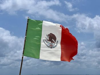 Low angle view of flag against sky