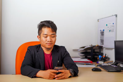 Young man using laptop on table