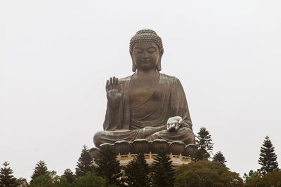 Low angle view of statue against clear sky