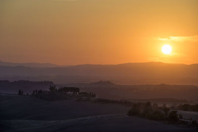 Scenic view of mountains against sky during sunset