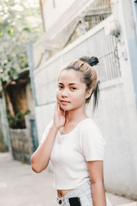 Portrait of smiling girl standing outdoors