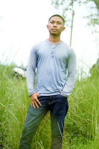 Young man standing on field