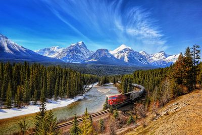 Scenic view of snowcapped mountains against sky during winter