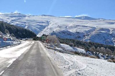 Scenic view of snow covered mountains against sky