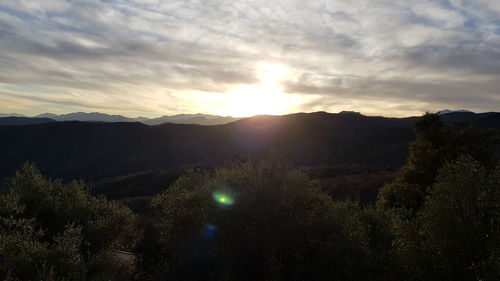 Scenic view of mountains against sky during sunset