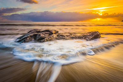 Scenic view of sea against sky during sunset