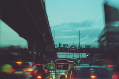 Close-up of cars moving on road