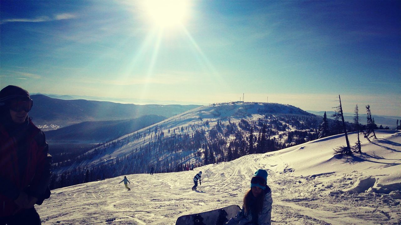 snow, winter, cold temperature, mountain, landscape, sun, sunlight, season, tranquil scene, scenics, tranquility, nature, sky, sunbeam, beauty in nature, leisure activity, mountain range, weather, lens flare