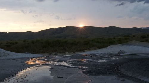 Scenic view of landscape against sky during sunset