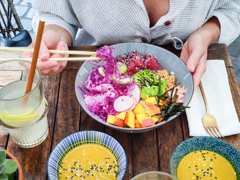 High angle view of woman preparing food on table