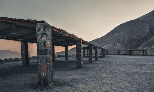 View of abandoned building against sky during sunset