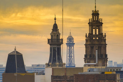 Historic buildings against sky during sunset