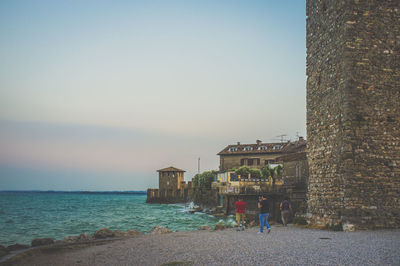 Old buildings on lakeshore