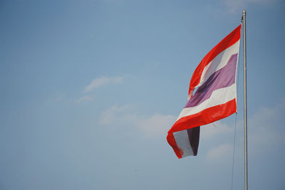 Low angle view of flag against sky