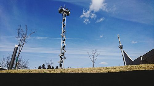 Low angle view of field against blue sky