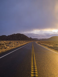 Road amidst landscape against sky