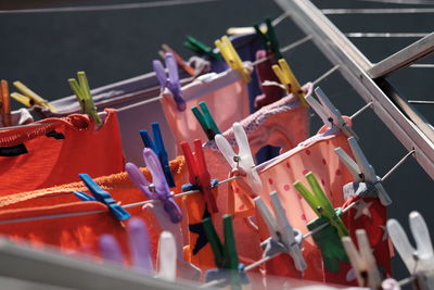 High angle view of multi colored clothespins on clothesline