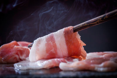 Close-up of meat on barbecue grill