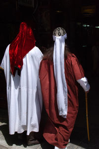 People standing in traditional clothing