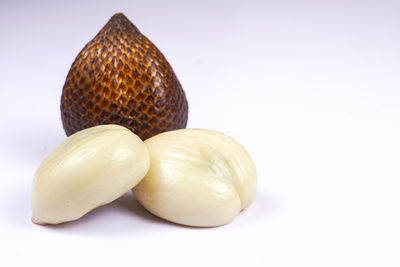 Close-up of fruit against white background