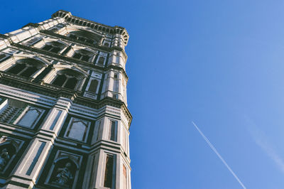 Low angle view of church against blue sky