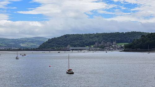 Sailboat on sea against sky