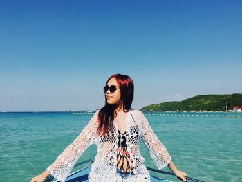 Portrait of young woman in sea