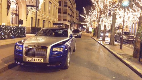 Car on illuminated city at night