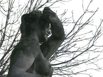 Low angle view of statue against sky