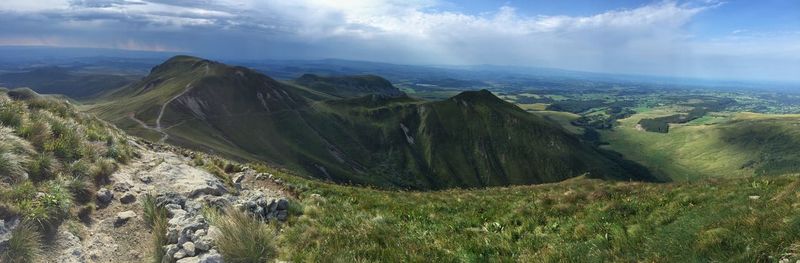 Panoramic view of landscape against cloudy sky