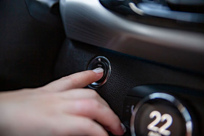 Close-up of hand holding car