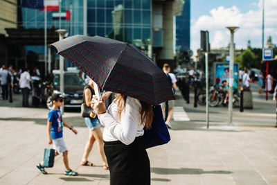 People on street in rain