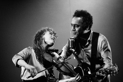 Young couple playing at music concert