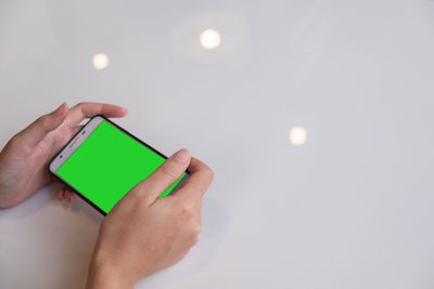 Close-up of hand holding illuminated lighting equipment