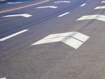 High angle view of arrow symbol on road