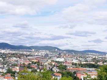 High angle view of houses in town against sky