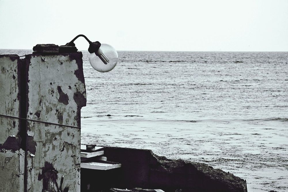 sea, horizon over water, water, clear sky, copy space, old, sky, abandoned, wood - material, rusty, beach, metal, day, outdoors, tranquility, no people, nautical vessel, weathered, tranquil scene, nature