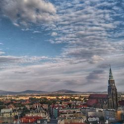 High angle view of cityscape against blue sky