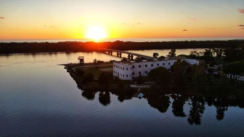 Scenic view of lake against sky during sunset