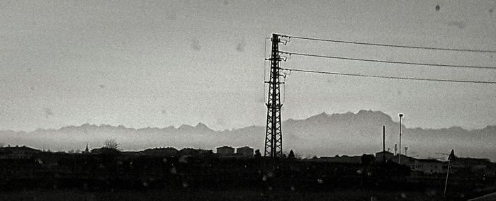 Electricity pylon against sky