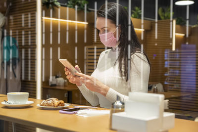 Young woman using mobile phone