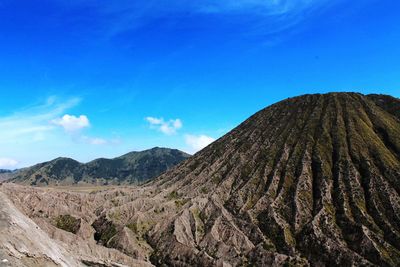 Low angle view of mt bromo against blue sky