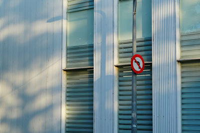 Text on closed shutter of building
