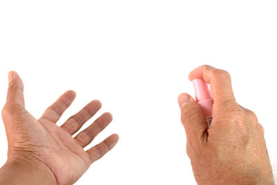 Close-up of hand against white background